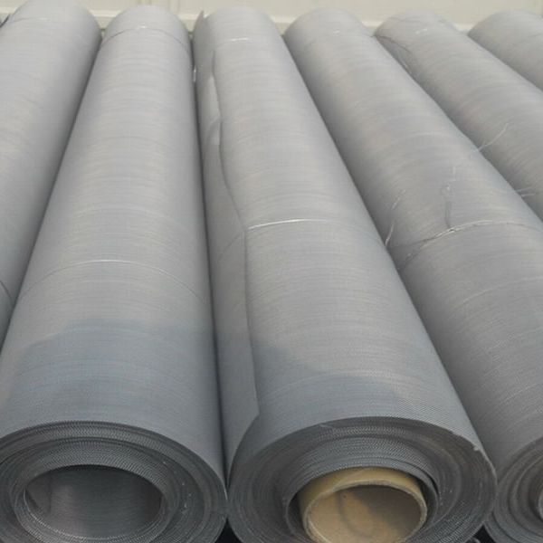 Many hastelloy woven mesh rolls are placed together.